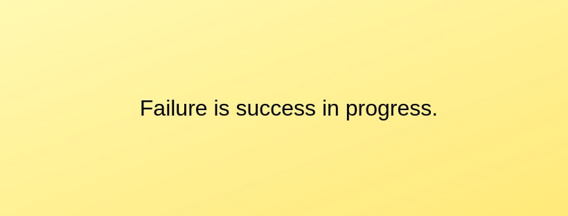 Yellow rectangle with the words “Failure is success in progress” in black print in the center of the rectangle. 